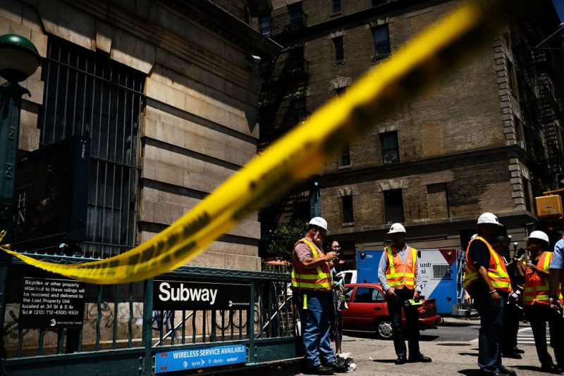 NEW YORK, NY - JUNE 27: Crime scene tape is placed outside of a Metropolitan Transportation Authority (MTA) Harlem subway station where a morning train derailment occurred on June 27, 2017 in New York City. Thirty-four people suffered minor injuries in the subway derailment which causes major delays throughout the morning and afternoon. This is the latest incident for the MTA, the largest subway system in the country, and has city officials scrambling to make repairs and updates to the aging system. (Photo by Spencer Platt/Getty Images)