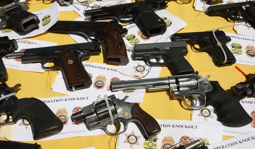 LAKEWOOD, CA - MAY 21: Some of about 125 weapons confiscated during what the federal authorities say is the largest gang takedown in United States history are displayed at a press conference to announce the arrests of scores of alleged gang members and associates on federal racketeering and drug-trafficking charges on May 21, 2009 in the Los Angeles-area community of Lakewood, California. 147 people were indicted in the case involving racially motivated attacks on African-Americans and law enforcement officers. Operation Knockout is the latest of several investigations that found gangs engaged in race-based violence. Two years ago, a Latino gang was charged with waging a violent campaign to drive blacks out of a Los Angeles-area neighborhood that resulted in 20 homicides. Last year, another Latino gang was accused of targeting blacks and killing 14-year-old Cheryl Green, whose death became a community rallying point. In 2006, Avenues gang members Latinos were convicted of assaults and killings of blacks in the 1990s. (Photo by David McNew/Getty Images)