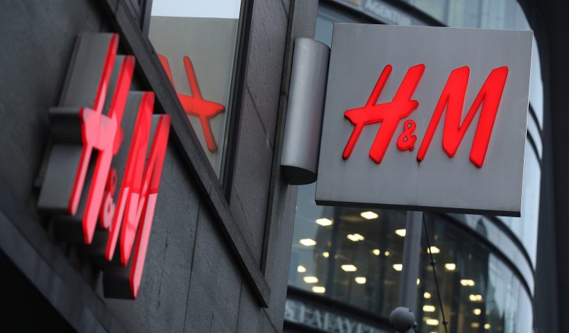 BERLIN, GERMANY - MARCH 28: The logo of Swedish clothing retailer H&M hangs over one of its stores on March 28, 2018 in Berlin, Germany. H&M, which is the world's second largest clothing retailer, announced yesterday it is struggling with plunging profits and rising inventories as popular demand for its clothes declines. (Photo by Sean Gallup/Getty Images)