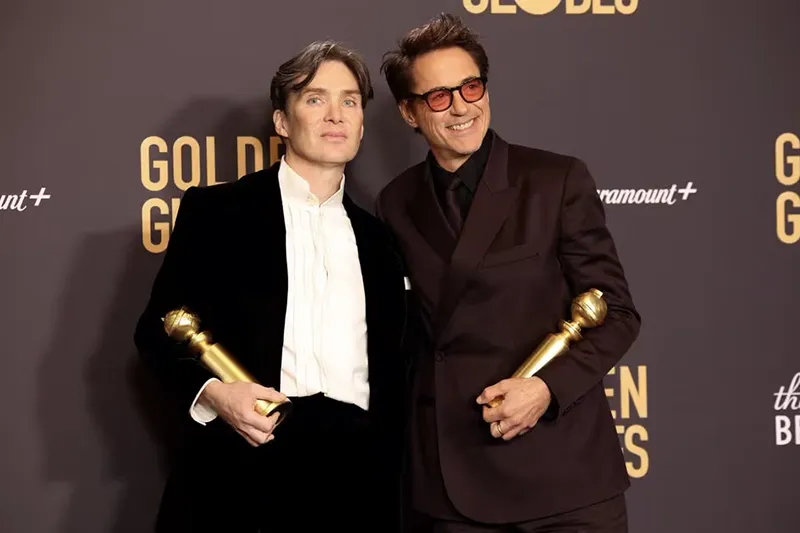 Robert Downey Jr. poses with the award for Best Motion Picture - Drama for "Oppenheimer" as Cillian Murphy holds the award for Best Performance by a Male Actor in a Motion Picture for "Oppenheimer" at the 81st Annual Golden Globe Awards in Beverly Hills, California, U.S., January 7, 2024. REUTERS/Mario Anzuoni