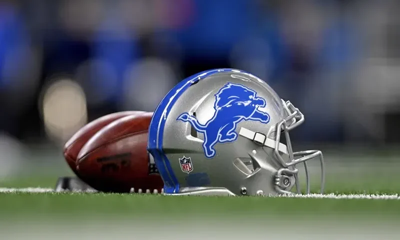 Footballs and a Detroit Lions helmet before a 2024 NFC wild card game between the Lions and Los Angeles Rams at Ford Field. Mandatory Credit: Lon Horwedel-USA TODAY Sports