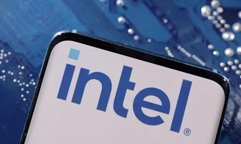 A smartphone with a displayed Intel logo is placed on a computer motherboard in this illustration taken March 6, 2023. REUTERS/Dado Ruvic/Illustration/File Photo