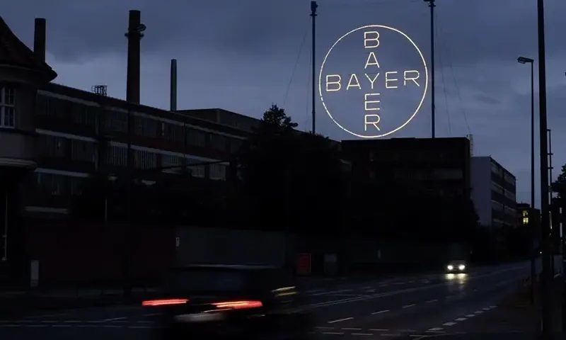 The 120 metres high Bayer Cross, logo of German pharmaceutical and chemical maker Bayer AG, consisting of 1710 LED glass bulbs is seen outside the industrial park "Chempark" of the chemical industry in Leverkusen, Germany, September 23, 2023. REUTERS/Wolfgang Rattay/File Photo