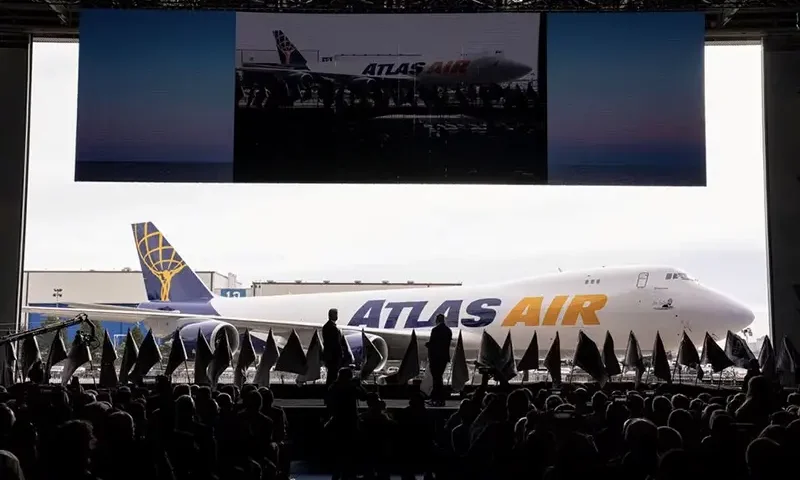 John W. Dietrich, president and CEO of Atlas Air Worldwide, and Dave Calhoun, CEO of Boeing, converse on stage during the delivery of the final 747 jet at their plant in Everett, Washington, U.S. January 31, 2023. REUTERS/David Ryder/File Photo