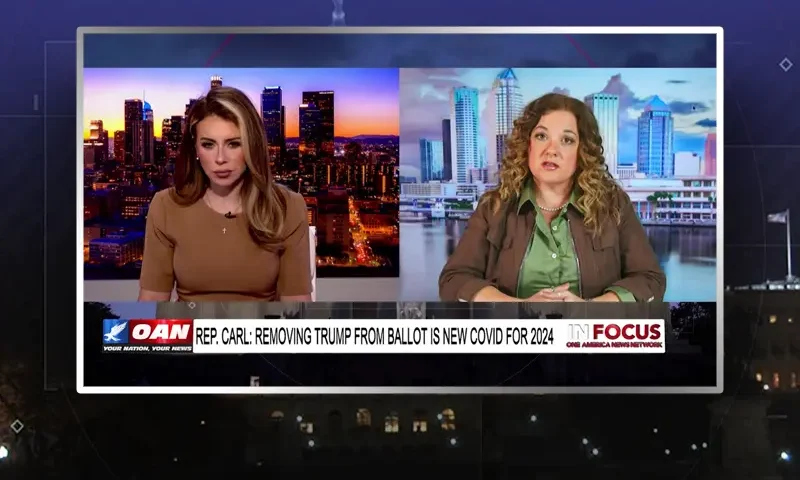 Video still from In Focus on One America News Network showing a split screen of the host on the left side, and on the right side is the guest, Krisanne Hall.