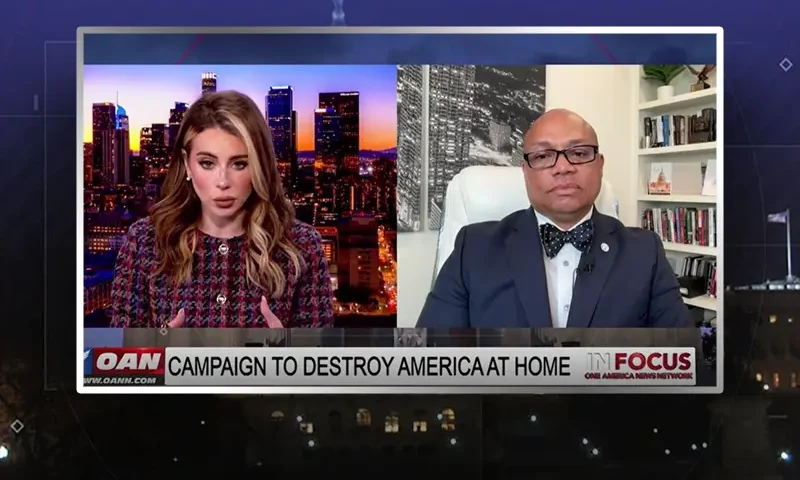 Video still from In Focus on One America News Network showing a split screen of the host on the left side, and on the right side is the guest, Virgil Walker.