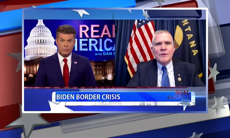 Video still from Real America on One America News Network showing a split screen of the host on the left side, and on the right side is the guest, Matt Rosendale.