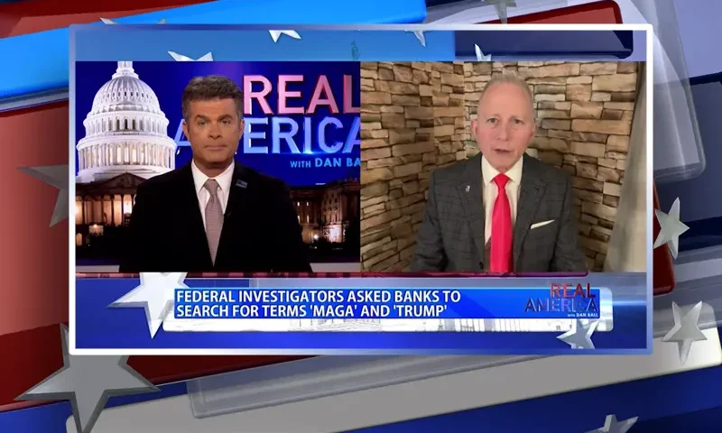 Video still from Real America on One America News Network showing a split screen of the host on the left side, and on the right side is the guest, Rep. Jeff Van Drew.