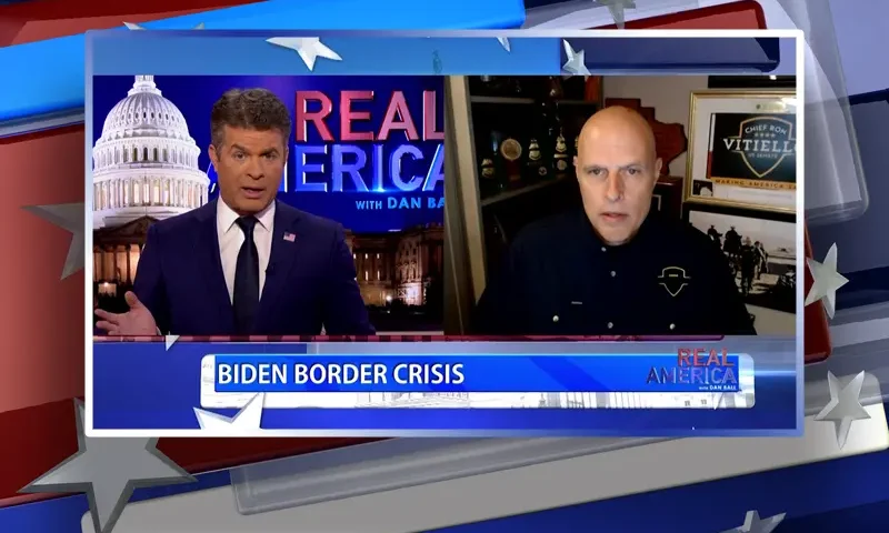 Video still from Real America on One America News Network showing a split screen of the host on the left side, and on the right side is the guest, Ron Vitiello.