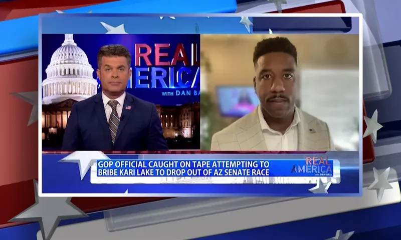Video still from Real America on One America News Network showing a split screen of the host on the left side, and on the right side is the guest, RC Maxwell.