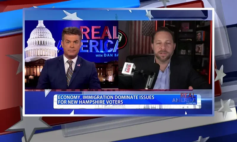 Video still from Real America on One America News Network showing a split screen of the host on the left side, and on the right side is the guest, David Pollack.