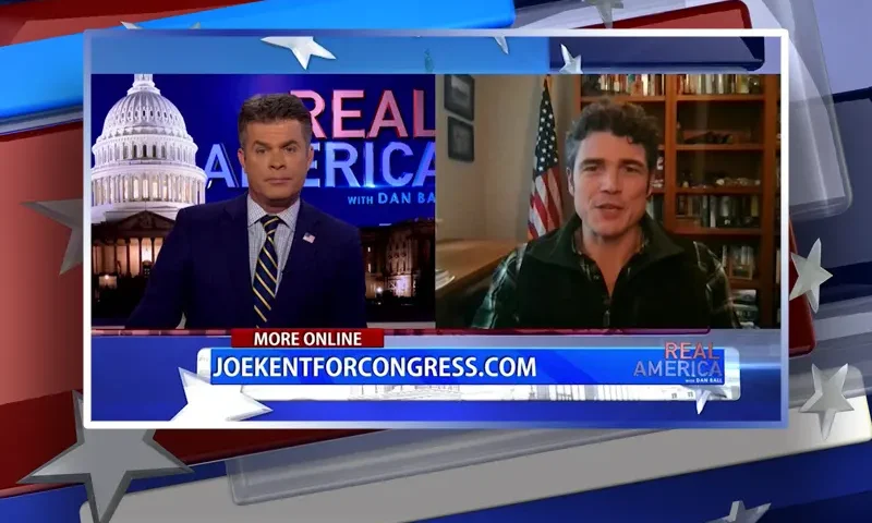 Video still from Real America on One America News Network showing a split screen of the host on the left side, and on the right side is the guest, Joe Kent.