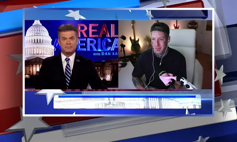 Video still from Real America on One America News Network showing a split screen of the host on the left side, and on the right side is the guest, Tom MacDonald.