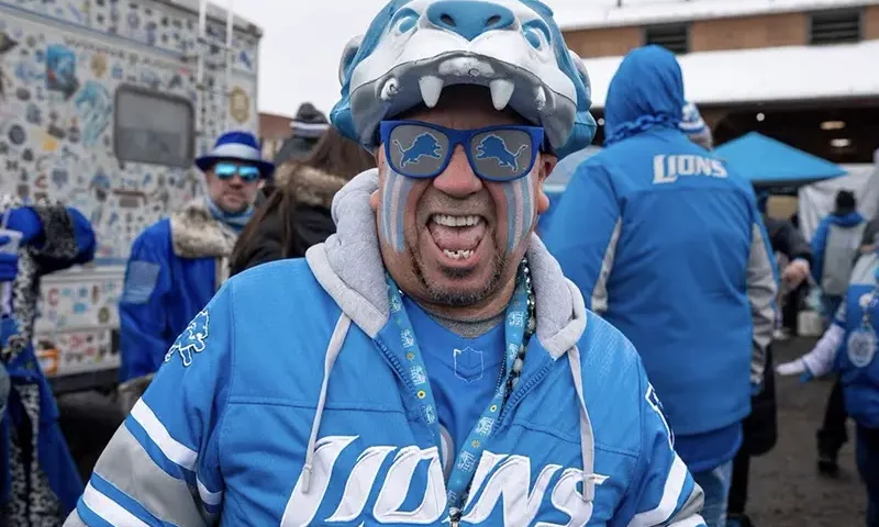 Robert Gonzales smiles for the camera during an early morning tailgate at Eastern Market before the Lions game against Tampa Bay at Ford Field. Mandatory Credit: David Rodriguez Munoz-USA TODAY Sports