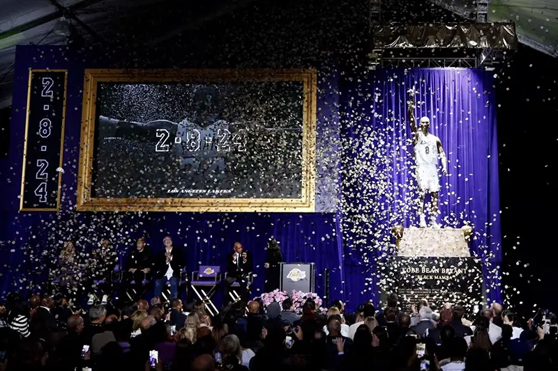A statue for former Los Angeles Lakers guard Kobe Bryant is unveiled during a ceremony at Star Plaza outside of Crypto.com ArenaMandatory Credit: Jason Parkhurst-USA TODAY Sports