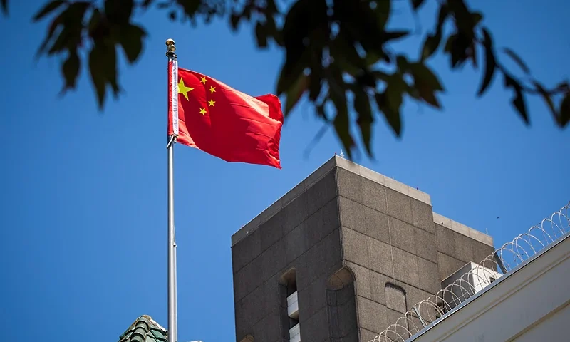 The flag of the People's Republic of China flies in the wind above the Consulate General of the People's Republic of China in San Francisco, California on July 23, 2020. - The US Justice Department announced July 23, 2020 the indictments of four Chinese researchers it said lied about their ties to the People's Liberation Army, with one escaping arrest by taking refuge in the country's San Francisco consulate. (Photo by Philip Pacheco / AFP) (Photo by PHILIP PACHECO/AFP via Getty Images)