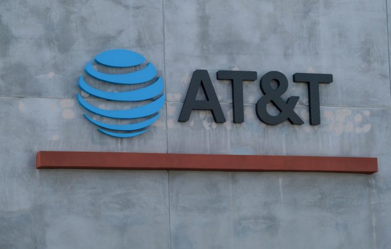The AT&T logo sign is seen above the store in Culver City, California on January 28, 2021. - US telecommunications firm AT&T announced on May 17, 2021 a merger between its WarnerMedia unit -- which owns CNN and HBO -- and Discovery media, creating a streaming giant that could compete with Netflix and Disney+. When the deal is finalized, AT&T will receive $43 billion and AT&T's shareholders will take stock representing 71 percent of the new company, with Discovery shareholders owning 29 percent. (Photo by Chris DELMAS / AFP) (Photo by CHRIS DELMAS/AFP via Getty Images)
