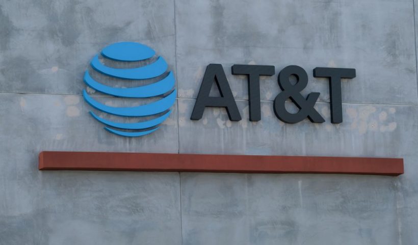 The AT&T logo sign is seen above the store in Culver City, California on January 28, 2021. - US telecommunications firm AT&T announced on May 17, 2021 a merger between its WarnerMedia unit -- which owns CNN and HBO -- and Discovery media, creating a streaming giant that could compete with Netflix and Disney+. When the deal is finalized, AT&T will receive $43 billion and AT&T's shareholders will take stock representing 71 percent of the new company, with Discovery shareholders owning 29 percent. (Photo by Chris DELMAS / AFP) (Photo by CHRIS DELMAS/AFP via Getty Images)