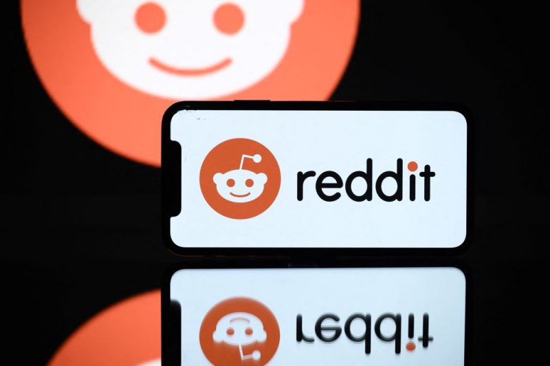 A picture taken on October 5, 2021 in Toulouse shows the logo of Reddit social media displayed by a by a tablet and a smartphone. (Photo by Lionel BONAVENTURE / AFP) (Photo by LIONEL BONAVENTURE/AFP via Getty Images)