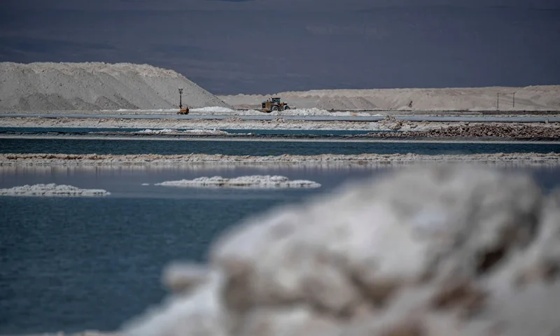 View of brine ponds and processing areas of the lithium mine of the Chilean company SQM (Sociedad Quimica Minera) in the Atacama Desert, Calama, Chile, on September 12, 2022. - The turquoise glimmer of open-air pools meets the dazzling white of a seemingly endless salt desert where hope and disillusionment collide in Latin America's "lithium triangle." A key component of batteries used in electric cars, demand has exploded for the "white gold" found in Argentina, Bolivia and Chile in quantities larger than anywhere else in the world. (Photo by Martin BERNETTI / AFP) (Photo by MARTIN BERNETTI/AFP via Getty Images)