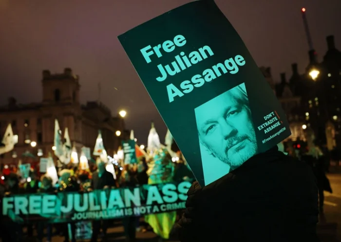 LONDON, ENGLAND - FEBRUARY 11: People carry placards during a protest in Westminster against Julian Assange's continued imprisonment on February 11, 2023 in London, England. Julian Assange faces a potential 175-year sentence if extradited to the US for his publishing work. All major free speech and human rights organisations including Amnesty, Reporters Without Borders, National Union of Journalists, Big Brother Watch and more oppose his extradition which they say is a 'threat to press freedom around the globe'. (Photo by Dan Kitwood/Getty Images)