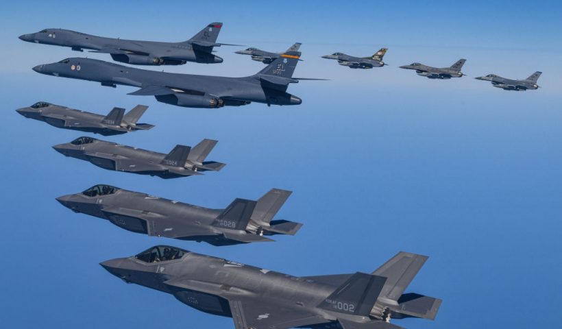 UNDISCLOSED LOCATION, SOUTH KOREA - MARCH 19: In this handout image released by the South Korean Defense Ministry, two U.S. Air Force B-1B bombers (top L) flying over South Korea with South Korean Air Force F-35A (L) and U.S. Air Force F-16 (top R) fighter jets during a combined air drill on March 19, 2023 at an undisclosed location in South Korea. U.S. B-1B strategic bomber returned to South Korea for combined exercises as North Korea fired yet another ballistic missile into the East Sea, according to the defense ministry. (Photo by South Korean Defense Ministry via Getty Images)