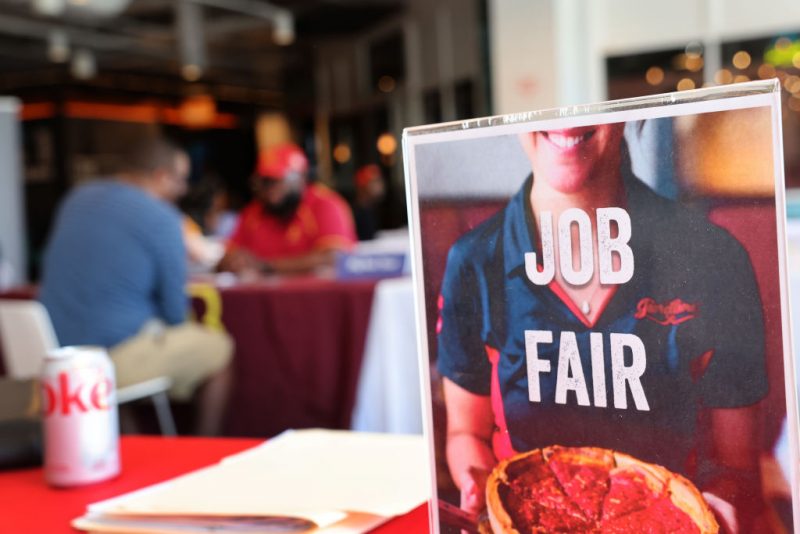 CHICAGO, ILLINOIS - APRIL 11: Job seekers speak with recruiters during a job fair at Navy Pier on April 11, 2023 in Chicago, Illinois. Companies at the fair were seeking mostly seasonal employees to work in tourism related fields. The U.S. unemployment rate currently stands at 3.5%. (Photo by Scott Olson/Getty Images)