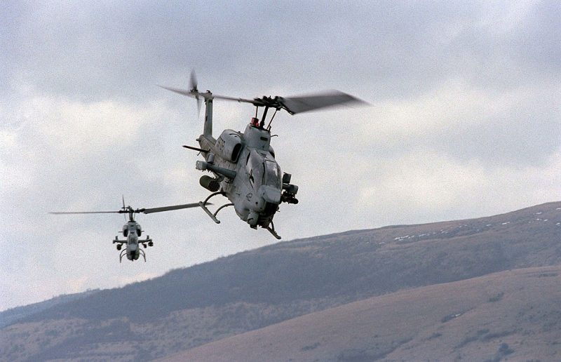BOSNIA - APRIL 2:  (FILE PHOTO) This handout photo from the U.S. Department of Defense shows two U.S. Marine AH-1W Super Cobra helicopters from the 26th Marine Expeditionary Unit training on April 2, 1998 in Bosnia. According to media reports, two Marine helicopters of this type crashed on January 22, 2003 near Zapata, Texas. Reports say that the aircraft were conducting a night time-time operation in conjunction with the U.S. Border Patrol in a drug smuggling case the agency was working on. All four Marines onboard the two helicopters were killed. (Photo by Steve Briggs/U.S. Navy/Getty Images)