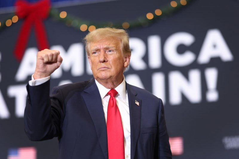 WATERLOO, IOWA - DECEMBER 19: Republican presidential candidate and former U.S. President Donald Trump gestures as he wraps up a campaign event on December 19, 2023 in Waterloo, Iowa. Iowa Republicans will be the first to select their party's nomination for the 2024 presidential race, when they go to caucus on January 15, 2024. (Photo by Scott Olson/Getty Images)