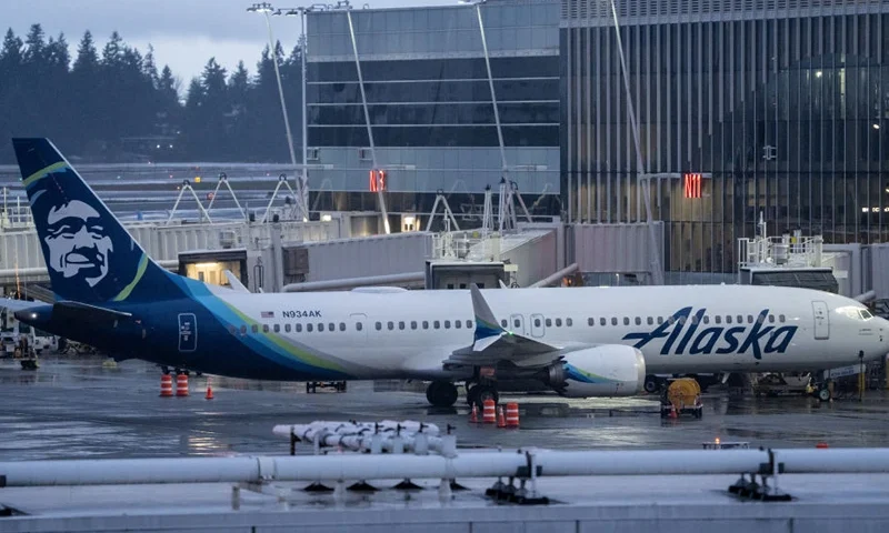 SEATTLE, WASHINGTON - JANUARY 6: An Alaska Airlines Boeing 737 MAX 9 plane sits at a gate at Seattle-Tacoma International Airport on January 6, 2024 in Seattle, Washington. Alaska Airlines grounded its 737 MAX 9 planes after part of a fuselage blew off during a flight from Portland Oregon to Ontario, California. (Photo by Stephen Brashear/Getty Images)