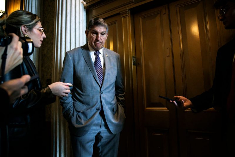 WASHINGTON, DC - JANUARY 23: U.S. Senator Joe Manchin (D-WV) talks to reporters as he leaves the Senate floor following a vote on January 23, 2024 in Washington, DC. Negotiations over border security, military aid to Ukraine and Israel, and the government budget continue this week on Capitol Hill. (Photo by Samuel Corum/Getty Images)