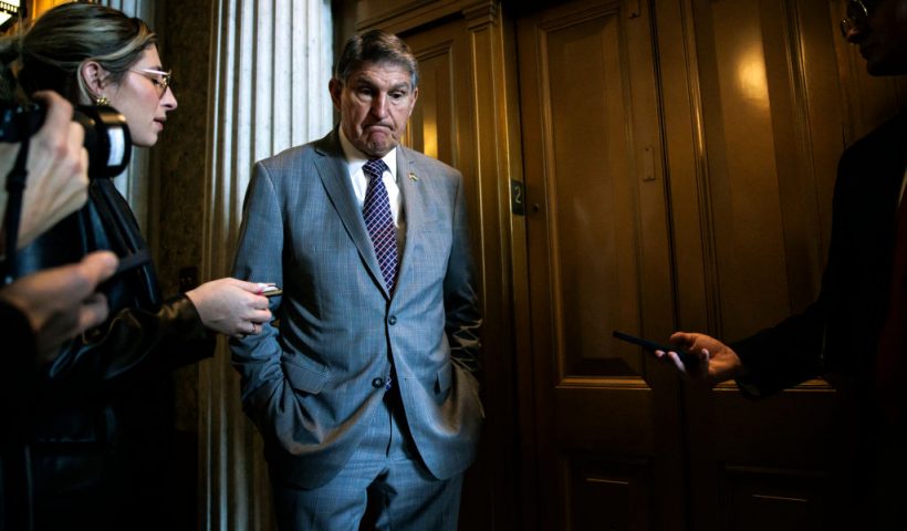WASHINGTON, DC - JANUARY 23: U.S. Senator Joe Manchin (D-WV) talks to reporters as he leaves the Senate floor following a vote on January 23, 2024 in Washington, DC. Negotiations over border security, military aid to Ukraine and Israel, and the government budget continue this week on Capitol Hill. (Photo by Samuel Corum/Getty Images)