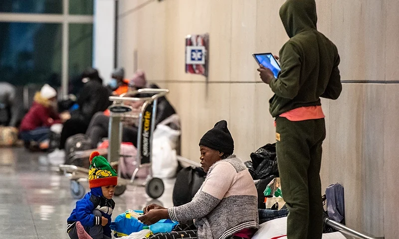 Migrants families use Terminal E at Boston Logan International Airport as a shelter on January 30, 2024, in Boston, Massachusetts. State officials are preparing to move the migrants to the Melnea Cass Recreation Complex in Roxbury, Massachusetts. The state has reached capacity in its shelter system with over 7,500 families in the various shelter programs. (Photo by Joseph Prezioso / AFP) (Photo by JOSEPH PREZIOSO/AFP via Getty Images)
