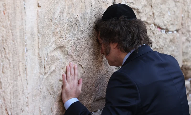 TOPSHOT-ISRAEL-ARGENTINA-PALESTINIAN-CONFLICT-DIPLOMACY TOPSHOT - Argentina's President Javier Milei prays at the Western Wall, the last remaining vestige of the Second Temple which is considered the holiest site where Jews can pray, in Jerusalem's Old City on February 6, 2024. (Photo by RONALDO SCHEMIDT / AFP) (Photo by RONALDO SCHEMIDT/AFP via Getty Images)