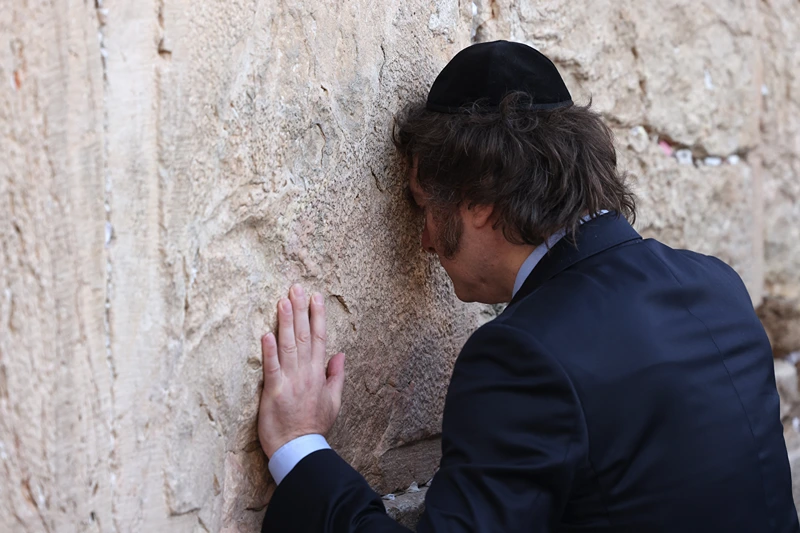 TOPSHOT-ISRAEL-ARGENTINA-PALESTINIAN-CONFLICT-DIPLOMACY
TOPSHOT - Argentina's President Javier Milei prays at the Western Wall, the last remaining vestige of the Second Temple which is considered the holiest site where Jews can pray, in Jerusalem's Old City on February 6, 2024. (Photo by RONALDO SCHEMIDT / AFP) (Photo by RONALDO SCHEMIDT/AFP via Getty Images)