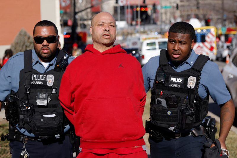 KANSAS CITY, MISSOURI - FEBRUARY 14: A man is detained by law enforcement following a shooting at Union Station during the Kansas City Chiefs Super Bowl LVIII victory parade on February 14, 2024 in Kansas City, Missouri. Several people were shot and two people were detained after a rally celebrating the Chiefs Super Bowl victory. (Photo by David Eulitt/Getty Images)
