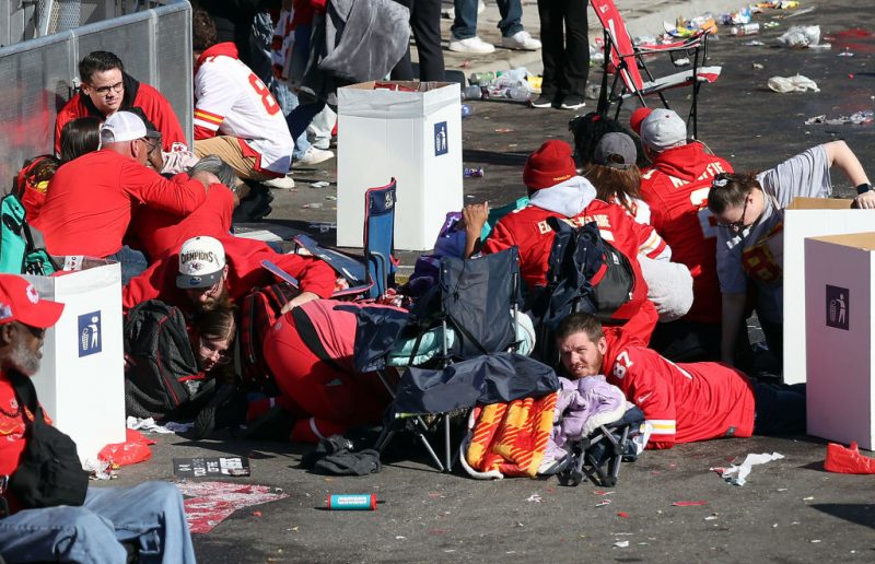 KANSAS CITY, MISSOURI - FEBRUARY 14: People take cover during a shooting at Union Station during the Kansas City Chiefs Super Bowl LVIII victory parade on February 14, 2024 in Kansas City, Missouri. Several people were shot and two people were detained after a rally celebrating the Chiefs Super Bowl victory. (Photo by Jamie Squire/Getty Images)