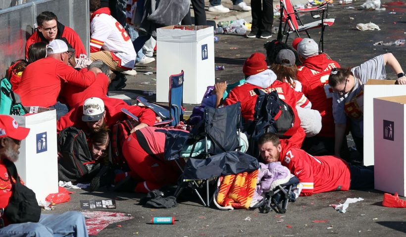 KANSAS CITY, MISSOURI - FEBRUARY 14: People take cover during a shooting at Union Station during the Kansas City Chiefs Super Bowl LVIII victory parade on February 14, 2024 in Kansas City, Missouri. Several people were shot and two people were detained after a rally celebrating the Chiefs Super Bowl victory. (Photo by Jamie Squire/Getty Images)