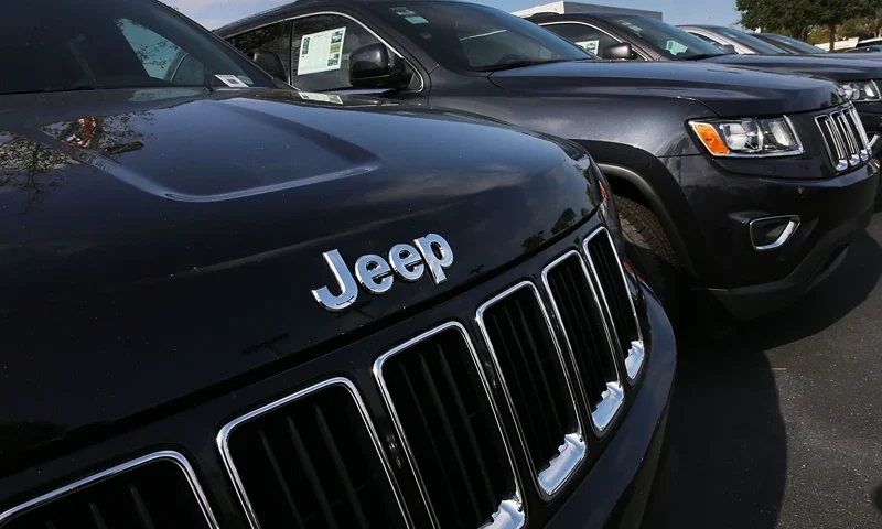 MIAMI, FL - APRIL 22: 2015 Jeep Grand Cherokee vehicles are seen on a sales lot as Fiat Chrysler Automobiles announced that it is recalling more than 1.1 million cars and SUVs worldwide because the vehicles may roll away after drivers exit the vehicles on April 22, 2016 in Miami, Florida. The recall covers the 2012-2014 Dodge Charger and Chrysler 300 sedans and 2014-2015 Jeep Grand Cherokee sport utility vehicles. (Photo by Joe Raedle/Getty Images)
