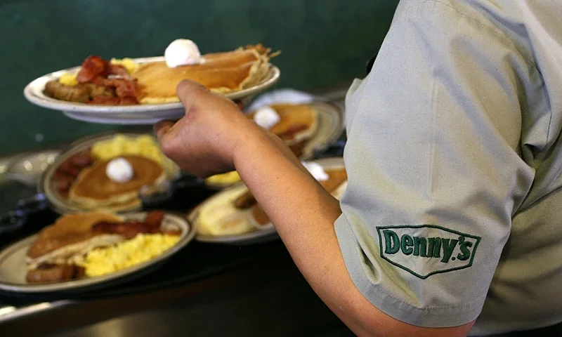 EMERYVILLE, CA - FEBRUARY 03: Denny's waitress Hirut Bizuneh prepares to deliver free Grand Slam breakfasts to customers February 3, 2009 in Emeryville, California. People lined up at Denny's across North America today for a free Grand Slam breakfast given away between 6am and 2pm at over 1,500 Denny's restaurants in the US, Puerto Rico and Canada. The promotion was announced during a Super Bowl commercial. (Photo by Justin Sullivan/Getty Images)