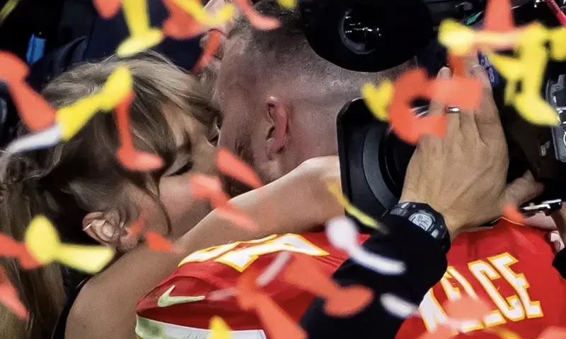 Kansas City Chiefs' Travis Kelce kisses partner Taylor Swift as they celebrate after Kansas City Chiefs win Super Bowl LVIII REUTERS/Carlos Barria