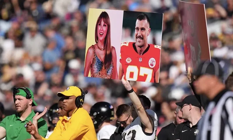 Army Black Knights members hold up a call in play sign of American recording artist Taylor Swift and American football player Travis Kelce in the first half against the Air Force Falcons at Empower Field at Mile High. Mandatory Credit: Ron Chenoy-USA TODAY Sports/File Photo