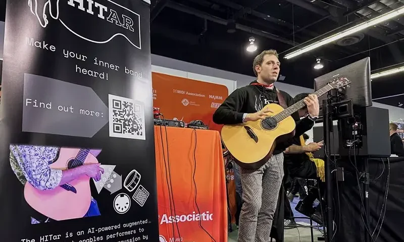 Andrea Martelloni, a PhD Student at the Queen Mary University of London, demonstrates the 'HITar', an AI-powered augmented guitar, at the 2024 National Association of Music Merchants (NAMM) trade show in Anaheim, California, U.S., January 25, 2024. REUTERS/Jorge Garcia/File Photo