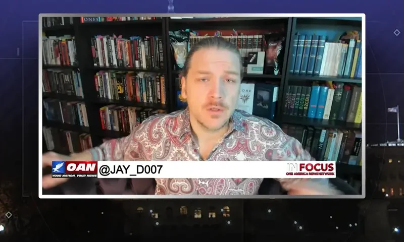 Video still from In Focus on One America News Network during an interview with the guest, Jay Dyer.