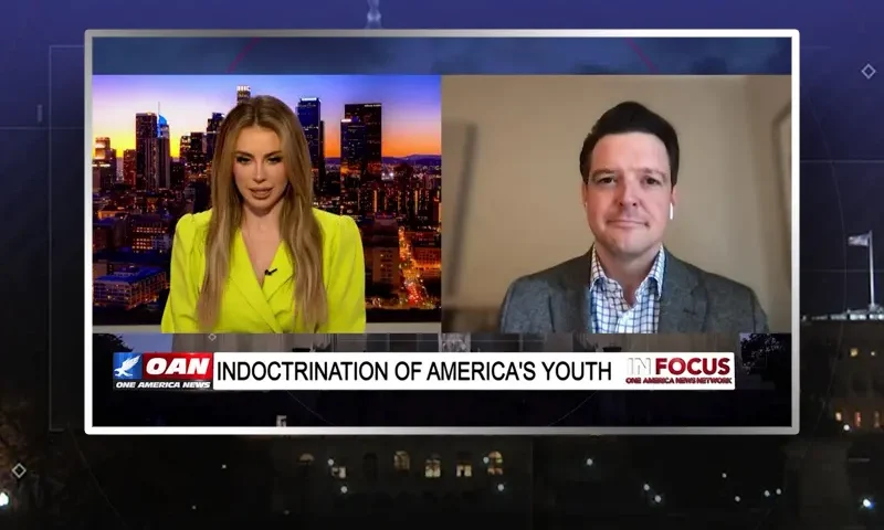 Video still from In Focus on One America News Network showing a split screen of the host on the left side, and on the right side is the guest, Ryan Helfenbein.