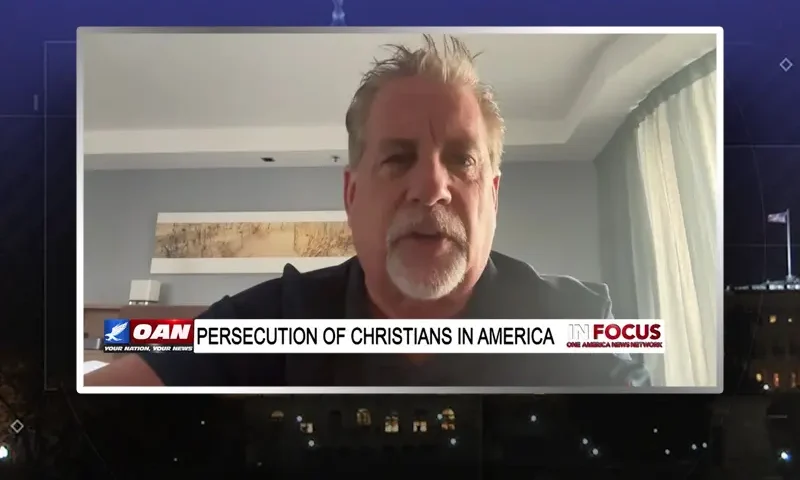 Video still from In Focus on One America News Network during an interview with the guest, Pastor Tom Hughes.