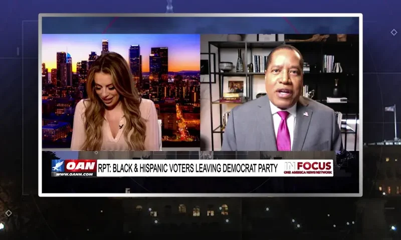 Video still from In Focus on One America News Network showing a split screen of the host on the left side, and on the right side is the guest, Larry Elder.