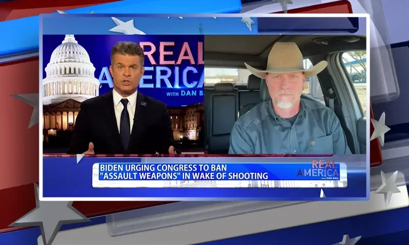 Video still from Real America on One America News Network showing a split screen of the host on the left side, and on the right side is the guest, Mark Lamb.