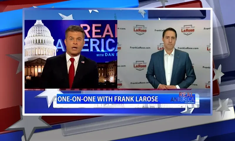 Video still from Real America on One America News Network showing a split screen of the host on the left side, and on the right side is the guest, Frank LaRose.