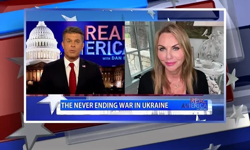 Video still from Real America on One America News Network showing a split screen of the host on the left side, and on the right side is the guest, Lara Logan.